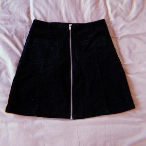 black corduroy skirt with pockets on front